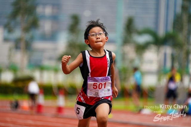 Youth athlete running on track